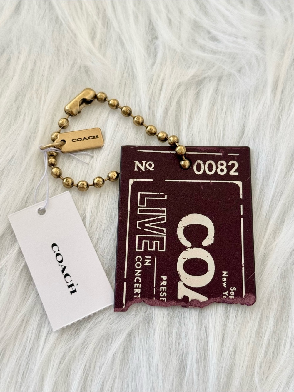 NWT COACH Leather Concert Bag charm With Brass Chain in Merlot CHQ92